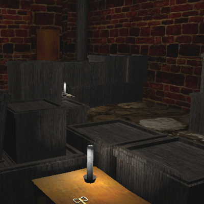 A screenshot from Stonewick Manor, a brick room filled with wooden boxes that act as makeshift walls. There is a table with a key on top, and candles littered throughout the room.